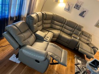 Sectional recliner packed in boxes