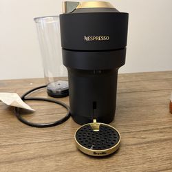 Black and gold nespresso machine