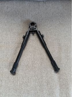 Rifle bipod for barrel.