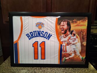 JALEN BRUNSON WITH THE NEW YORK KNICKS STITCHED,BRANDED AUTHENTIC FRAMED JERSEY.