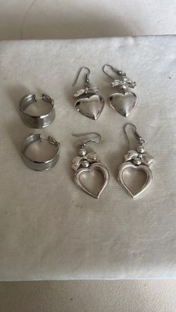 Silver Earrings With The Heart Designs 