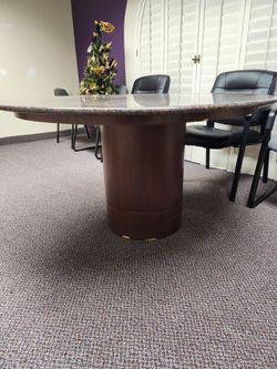 Granite tabletop office conference table. Diameter= 4ft 3in and height = 2ft 5 in. Alsob9nclyded is a 7 ft. By 1 ft. Rectangular solid piece of marble