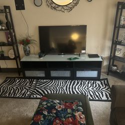 A Tv Stand That Will Fit Up To A 75 Inch Tv
