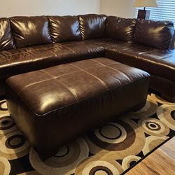 Brown faux leather sectional with ottoman