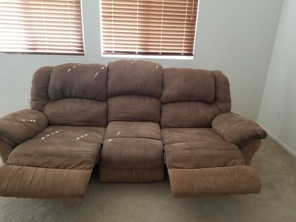 Brown suede couch with double recliners.