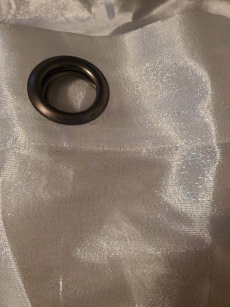 Beautiful sheer curtains. Silvery white color 32 in wide 84 inch long. 1 panel cover a standard size window.