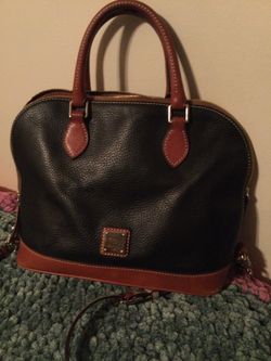 Dooney And Bourke Black Leather Zip Zip Purse.