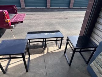 3 black glass tables