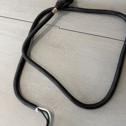 Durable power cord with three-prong plug and exposed wires.