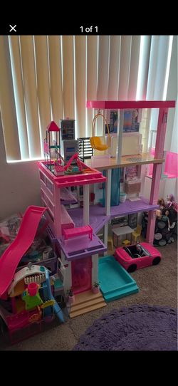 Barbie house, includes 2 Barbie cars, over 20 Barbie sets.