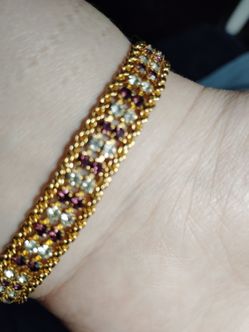Gold, with purple and white gemstone bracelet