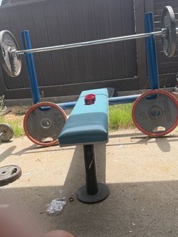 Bench press with Olympic bar and weights