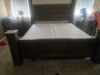 King bed frame with box springs.