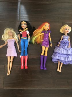 4 barbie doll with 6 additional outfit changes