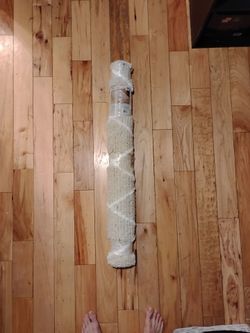 Cream Shag Area Rug Rolled in Plastic