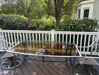 Free outdoor deck table metal with glass. Needs repainting