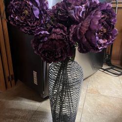 Black Metal vase with purple silk flowers. 22 inch tall vase