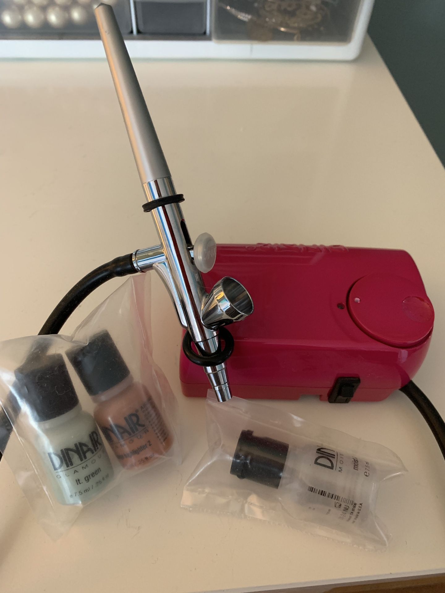 Dinair airbrush machine