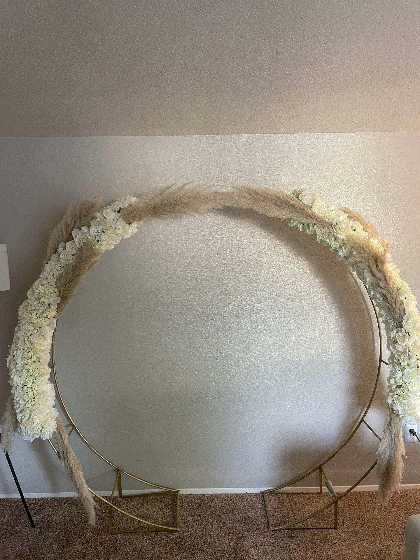 GOLD WEDDING ARBOR WITH WHITE ROSES AND PAMPAS GRASS