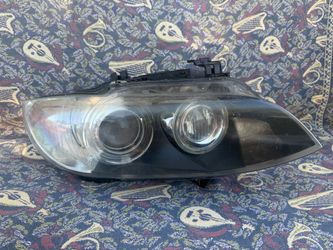Left headlight assembly used on 2007–2010 BMW