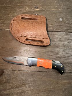 Custom pocket knife with leather sheath