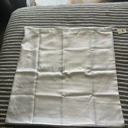 New with tag. Keep your favorite MK accessories safe with this X Large Dust Bag by MICHAEL Michael Kors. Extra Large sized bag; 22"W x 22"H Drawstr