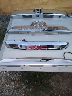 Lift gate handles and front grill pieces