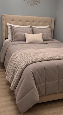 Full size bed with frame and mattress and box spring.