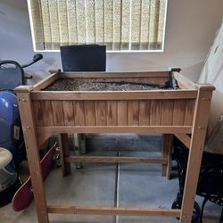 Raised planter box with fertilized soil