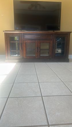 Big cabinet with lots of storage you could easily fit a big tv on there and a gaming console.