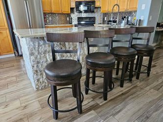 Four beautiful counter Height swivel bar stools