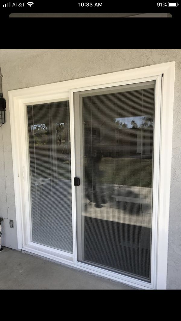 Vinyl sliding patio doors/with mini blinds for Sale in Riverside, CA