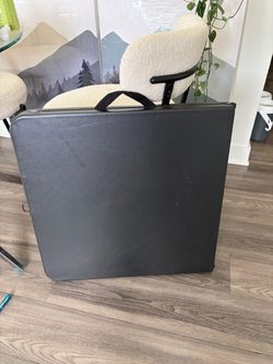 Black fold-in- half utility table