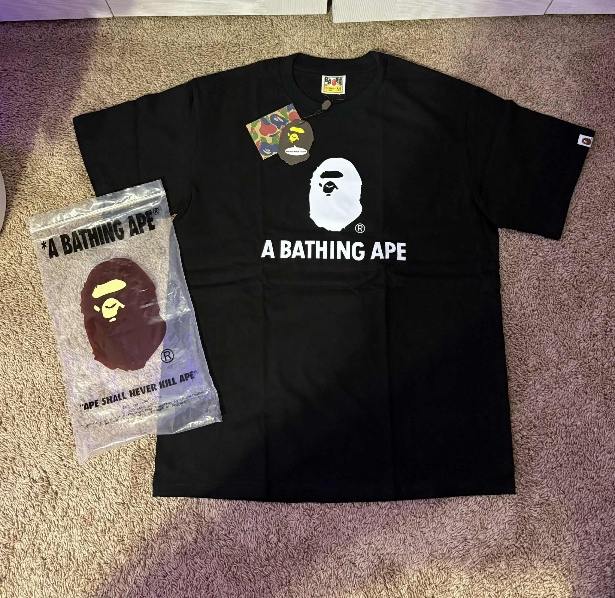 Black bape shirt with little white bape head size medium