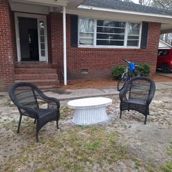 Two wicker chairs won wicker table