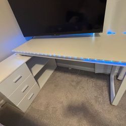 A secretary desk with a drop-down shelf and upper cabinet.