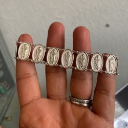 silver slave with the image of San Juditas Tadeo