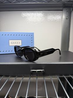 Gucci Black Oval Sunglasses