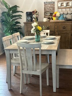 Dining room table and chairs and one bench