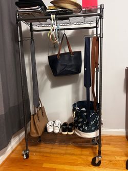 Sturdy clothes rail with shelves and wheels