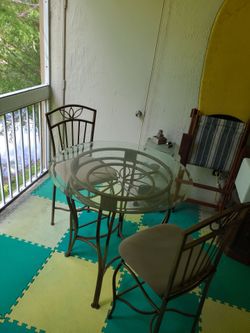 High top table in 2 chairs.