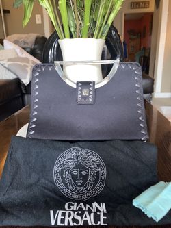 Versace Clutch Bag From the Flagship Store In Italy. Vintage.  Still Has Dust bag. Very Well Taken Care Of. 