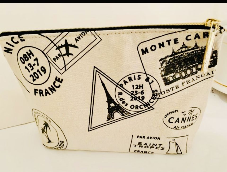 Large Makeup/cosmetic bag. 9” x 7” x 3” Lancôme Brand, With French black Icons all over ivory canvas fabric. Comes from a smoke free environment.