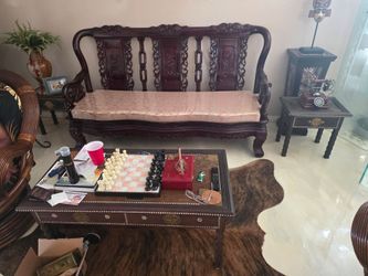 Ornately carved wooden Dragon bench with cushions