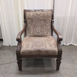 Traditional Carved Wood Accent Chair with Patterned Upholstery
