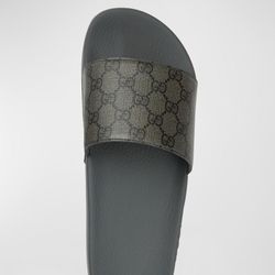 All black Gucci slides 