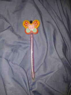A butterfly pen with pretty glitter inside it