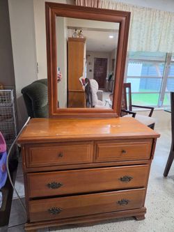 Wooden dresser with mirror