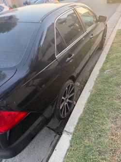 Black 4-Door Sedan with Custom Wheels