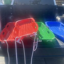 Booway sleds two red one green one blue